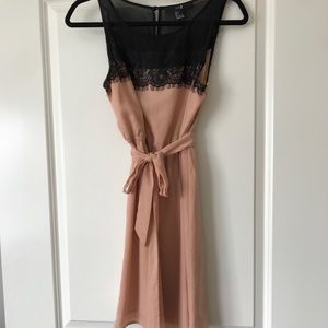 Lace, silky, peach colored dress.